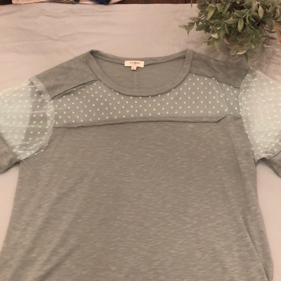 Umgee Tops - Tunic length top with cute mesh details.
